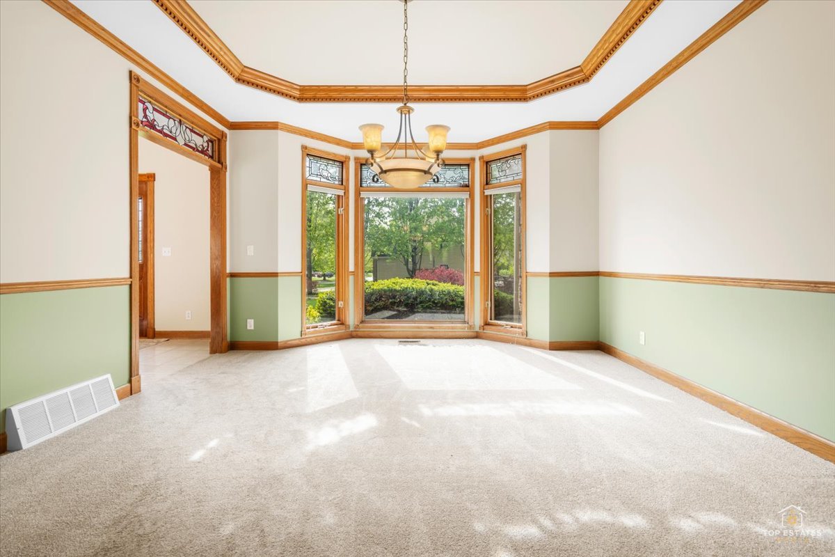 601 Ridgelawn Trail Batavia, IL 60510 - Photo 9 of 57 a view of an empty room with a window