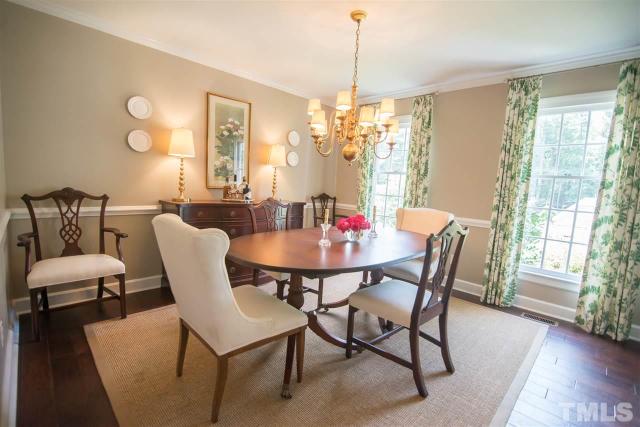2209 Basil Drive Raleigh, NC 27612 - Photo 5 of 25 a view of a dining room with furniture window and wooden floor