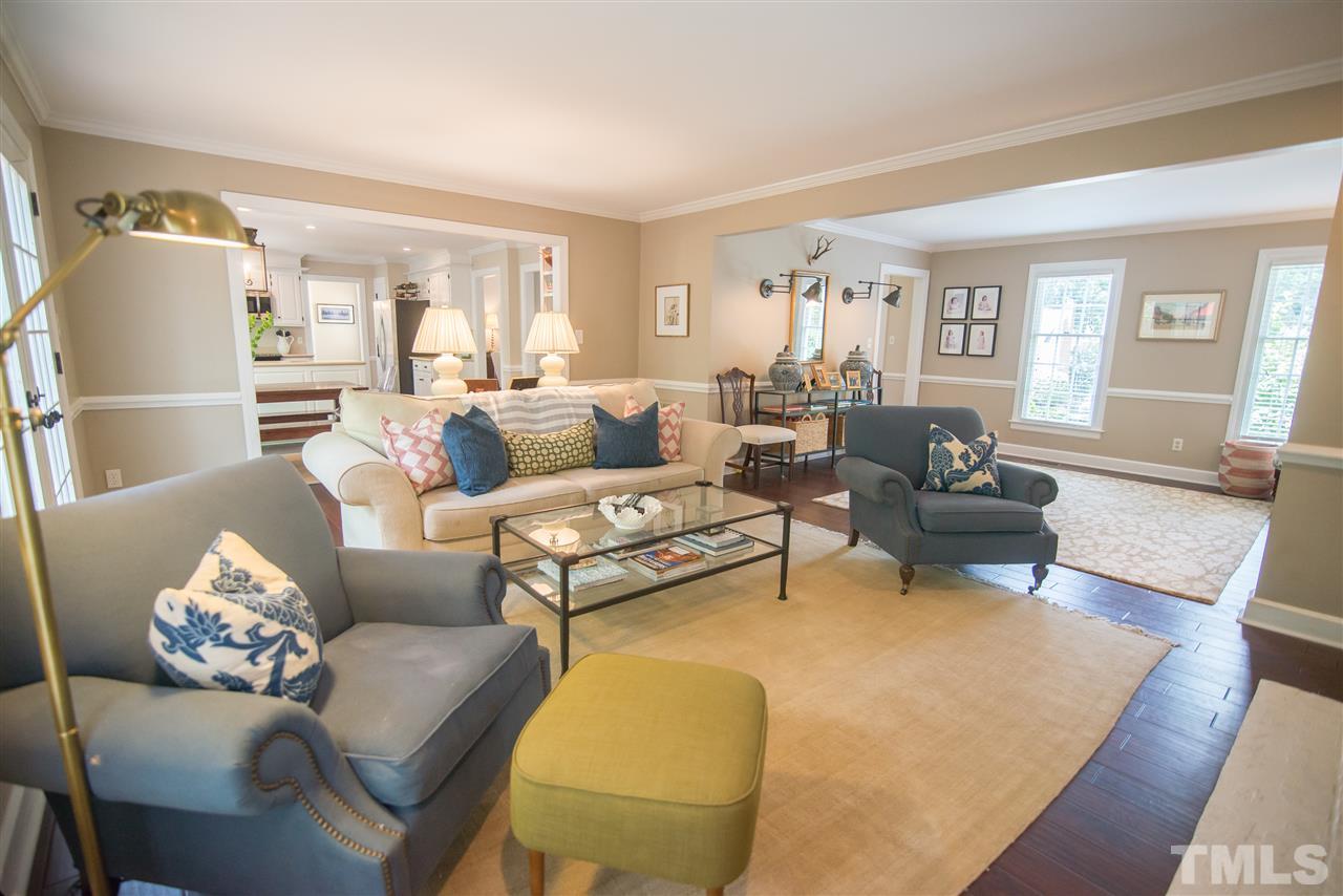 2209 Basil Drive Raleigh, NC 27612 - Photo 9 of 25 a living room with furniture and a table