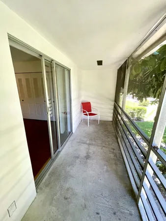 a view of a hallway with furniture