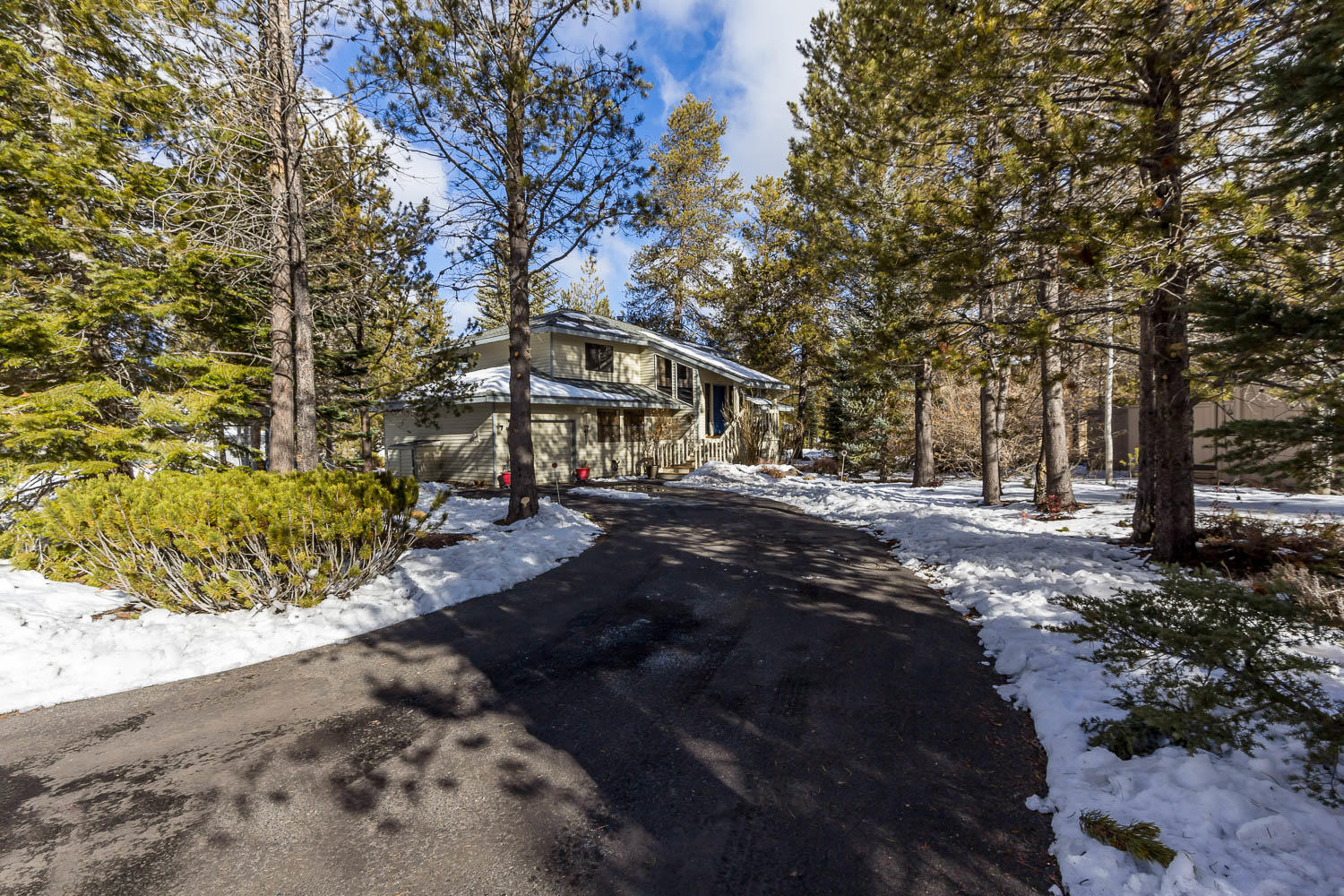17704 Rogue Lane Sunriver, OR 97707 - Photo 2 of 26 a view of house with trees in the background