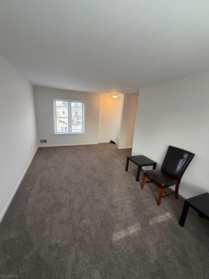 101 Liberty Street, Unit 2 Bloomfield, NJ 07003 - Photo 4 of 11 a living room with furniture and a window