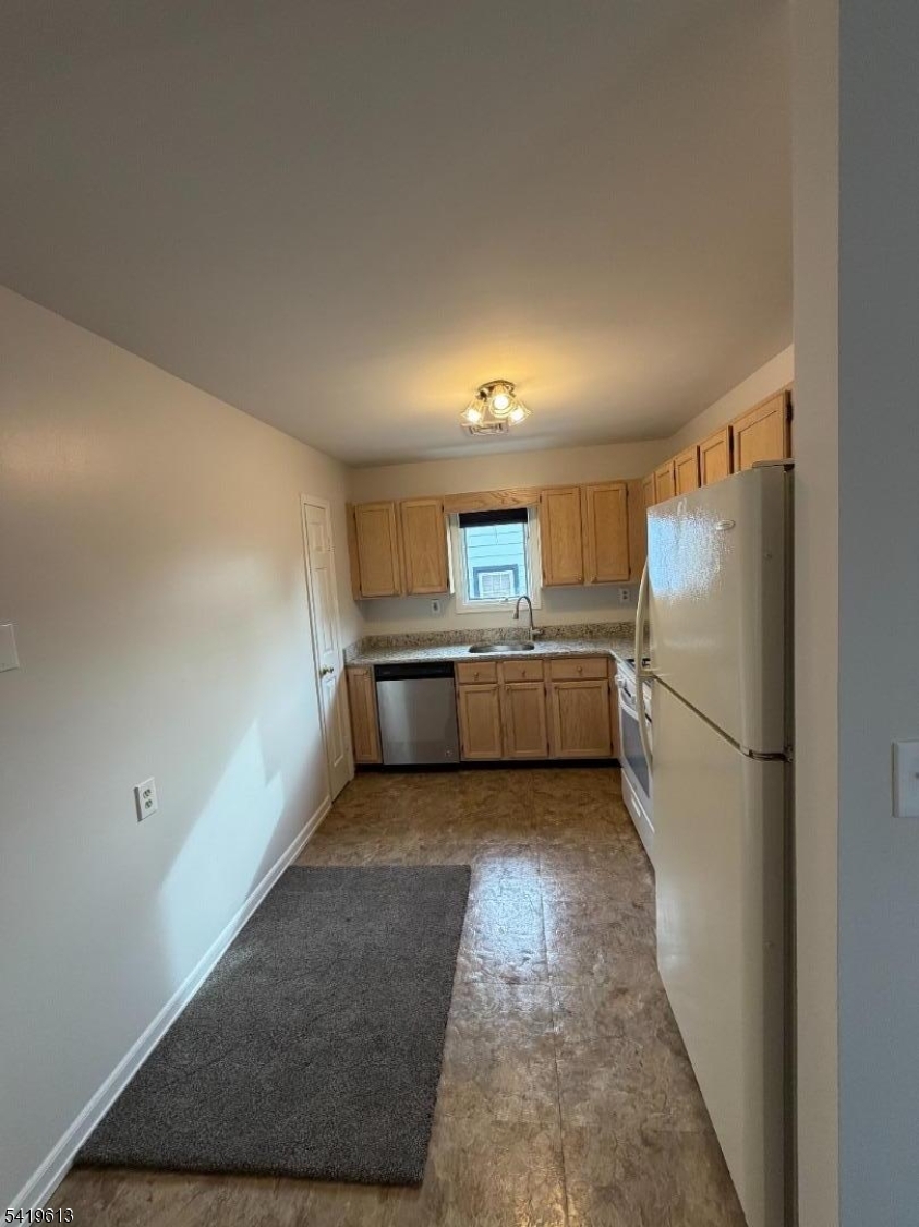 101 Liberty Street, Unit 2 Bloomfield, NJ 07003 - Photo 5 of 11 a kitchen with a refrigerator and a stove