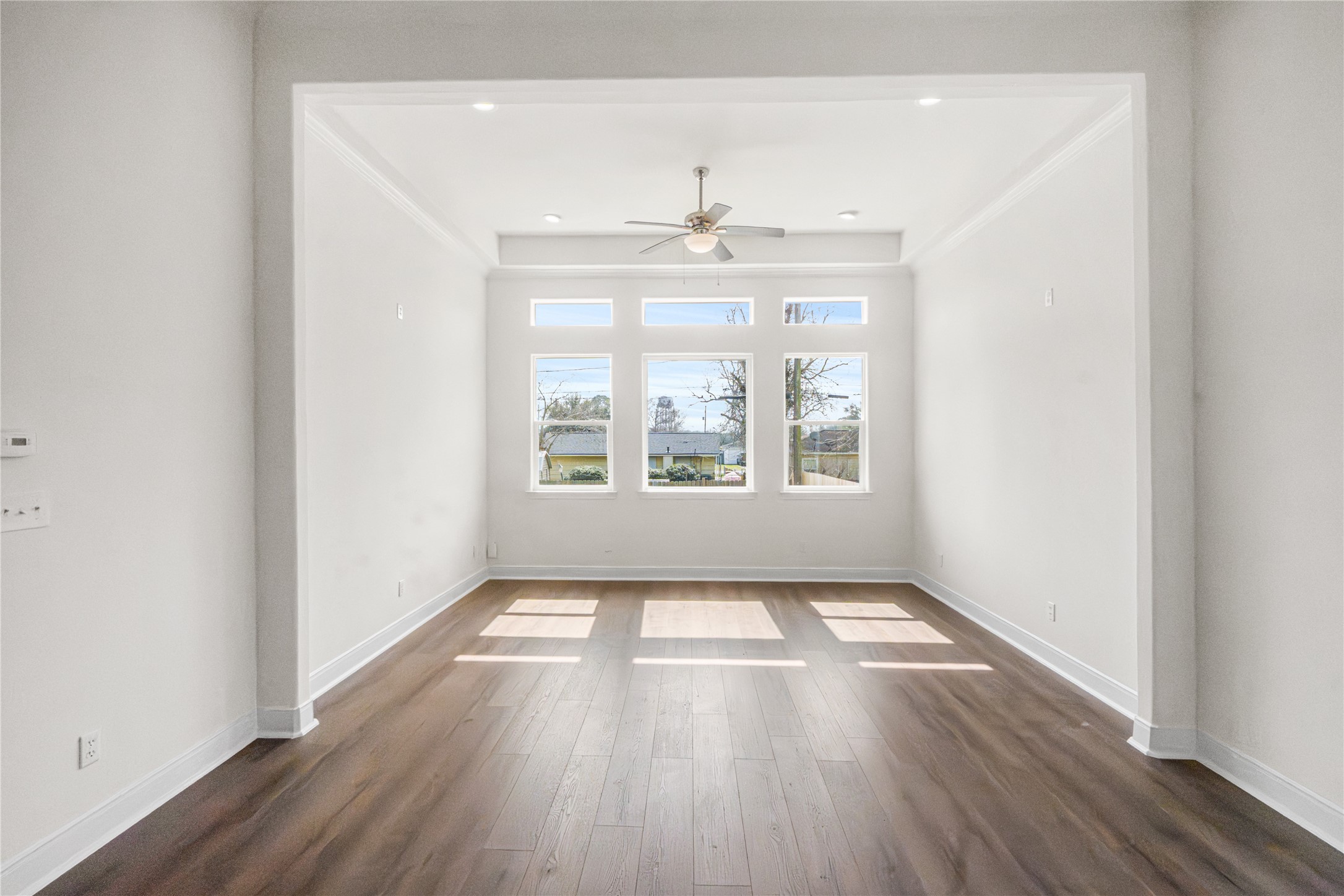 6413 North Ridgecrest Drive Hitchcock, TX 77563 - Photo 14 of 29 an empty room with wooden floor and windows