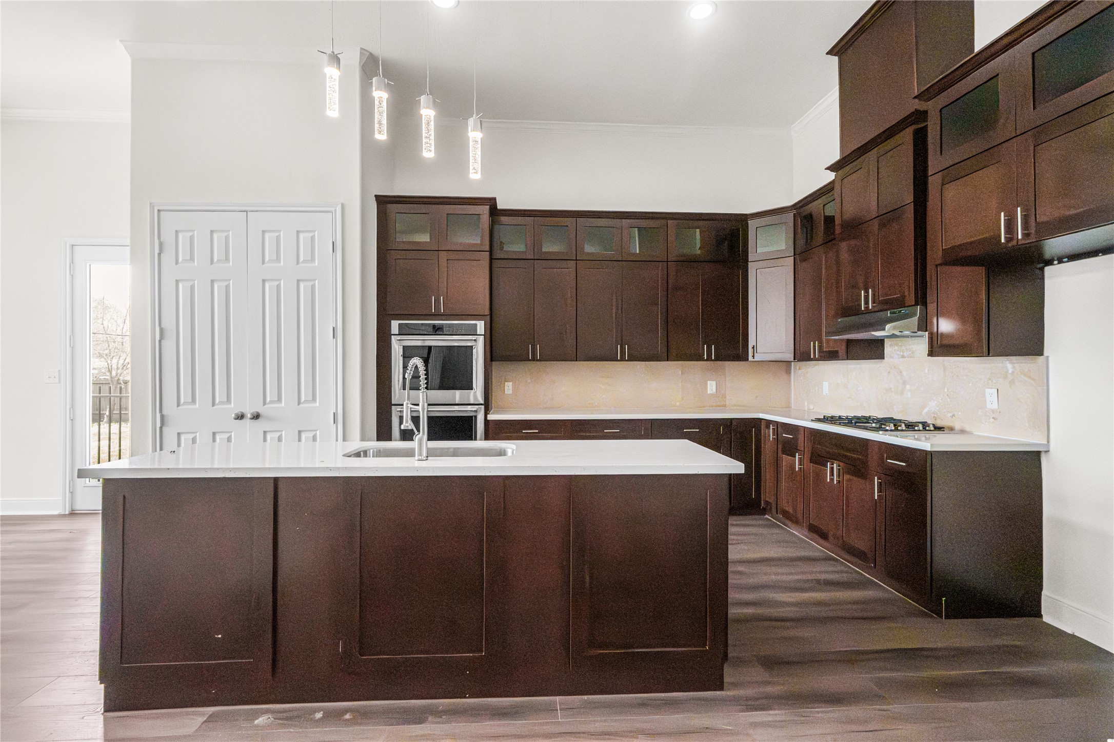 6413 North Ridgecrest Drive Hitchcock, TX 77563 - Photo 9 of 29 a large kitchen with stainless steel appliances wooden cabinets a refrigerator and a stove