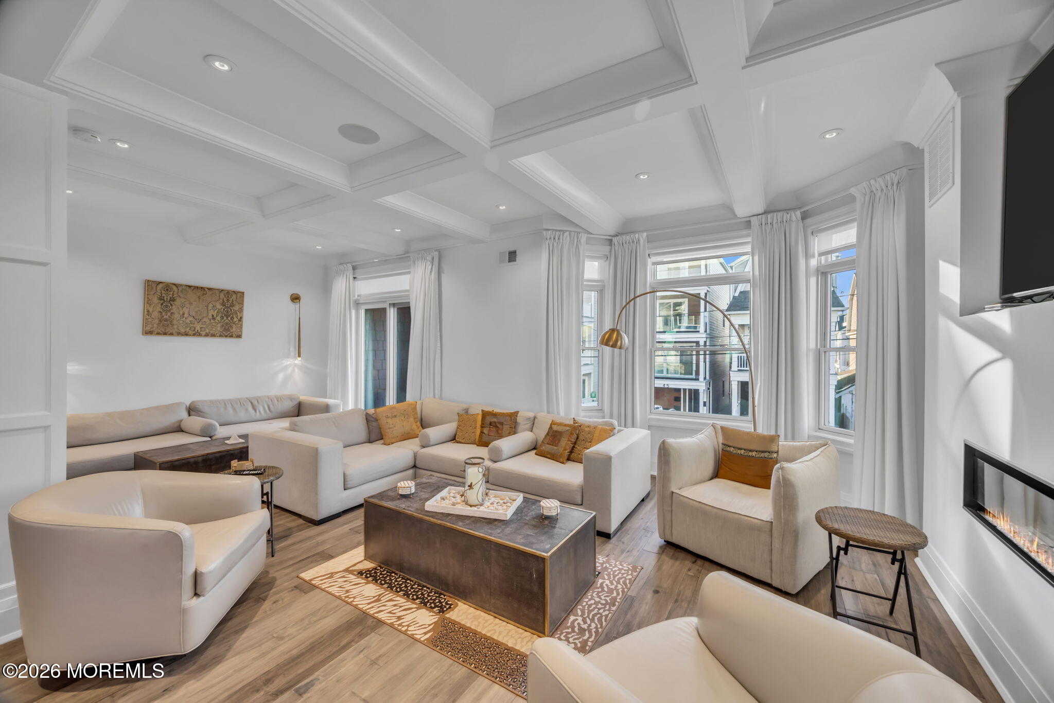 42 Marine Terrace Long Branch, NJ 07740 - Photo 12 of 36 a living room with furniture wooden floor and a large window