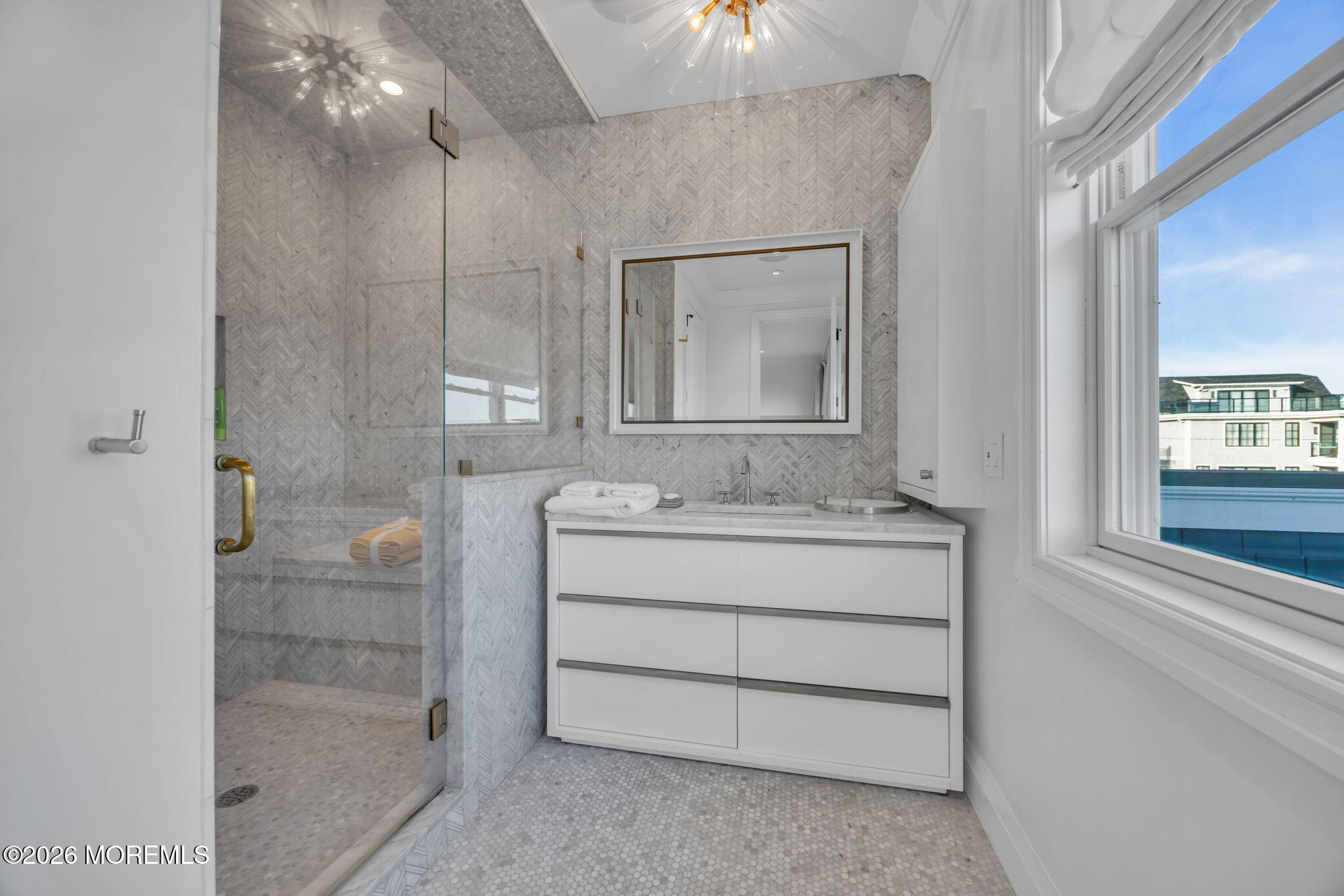 42 Marine Terrace Long Branch, NJ 07740 - Photo 21 of 36 a bathroom with a shower sink and mirror