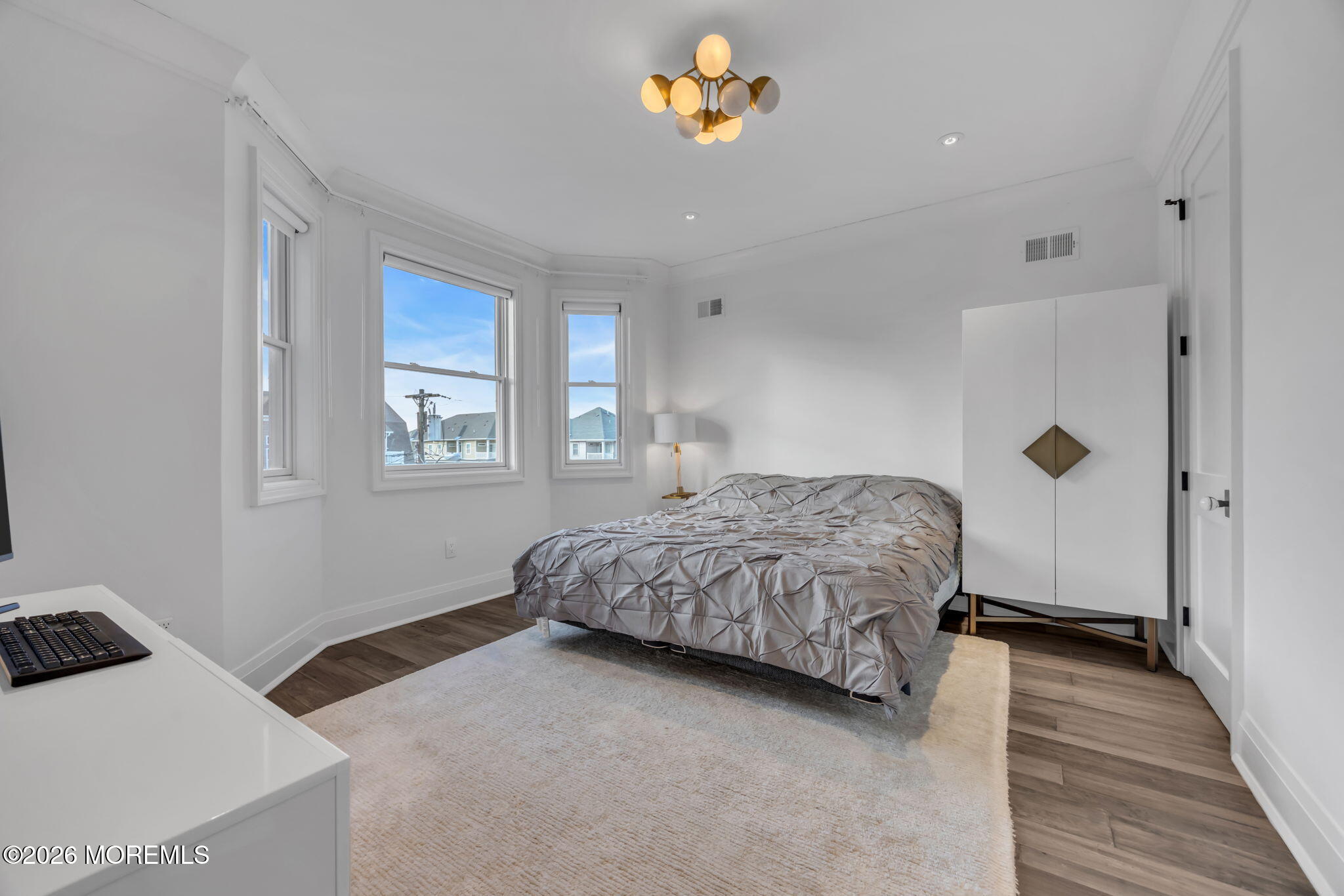 42 Marine Terrace Long Branch, NJ 07740 - Photo 24 of 36 a bedroom with a bed and a window