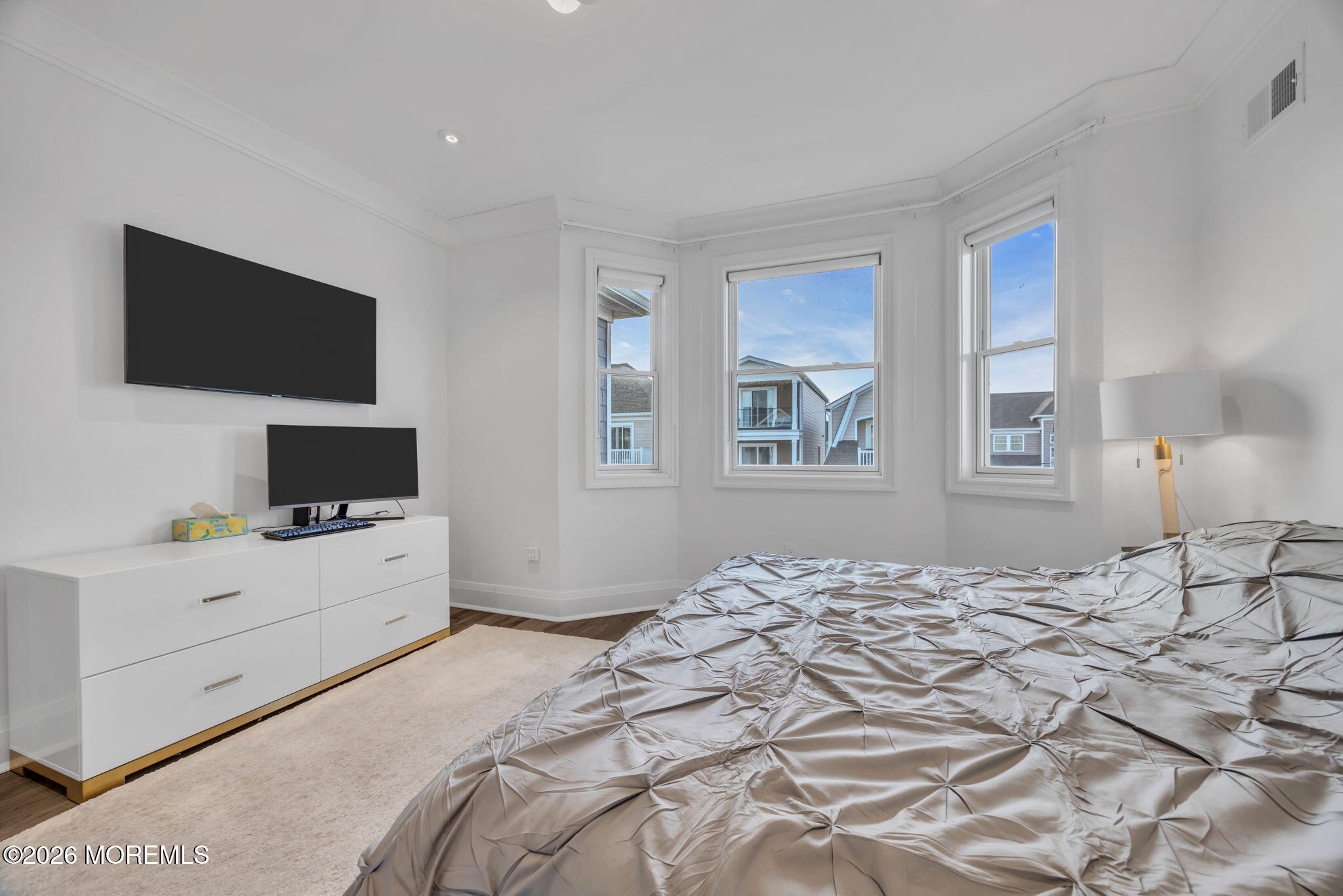 42 Marine Terrace Long Branch, NJ 07740 - Photo 25 of 36 a bedroom with a bed and flat screen tv