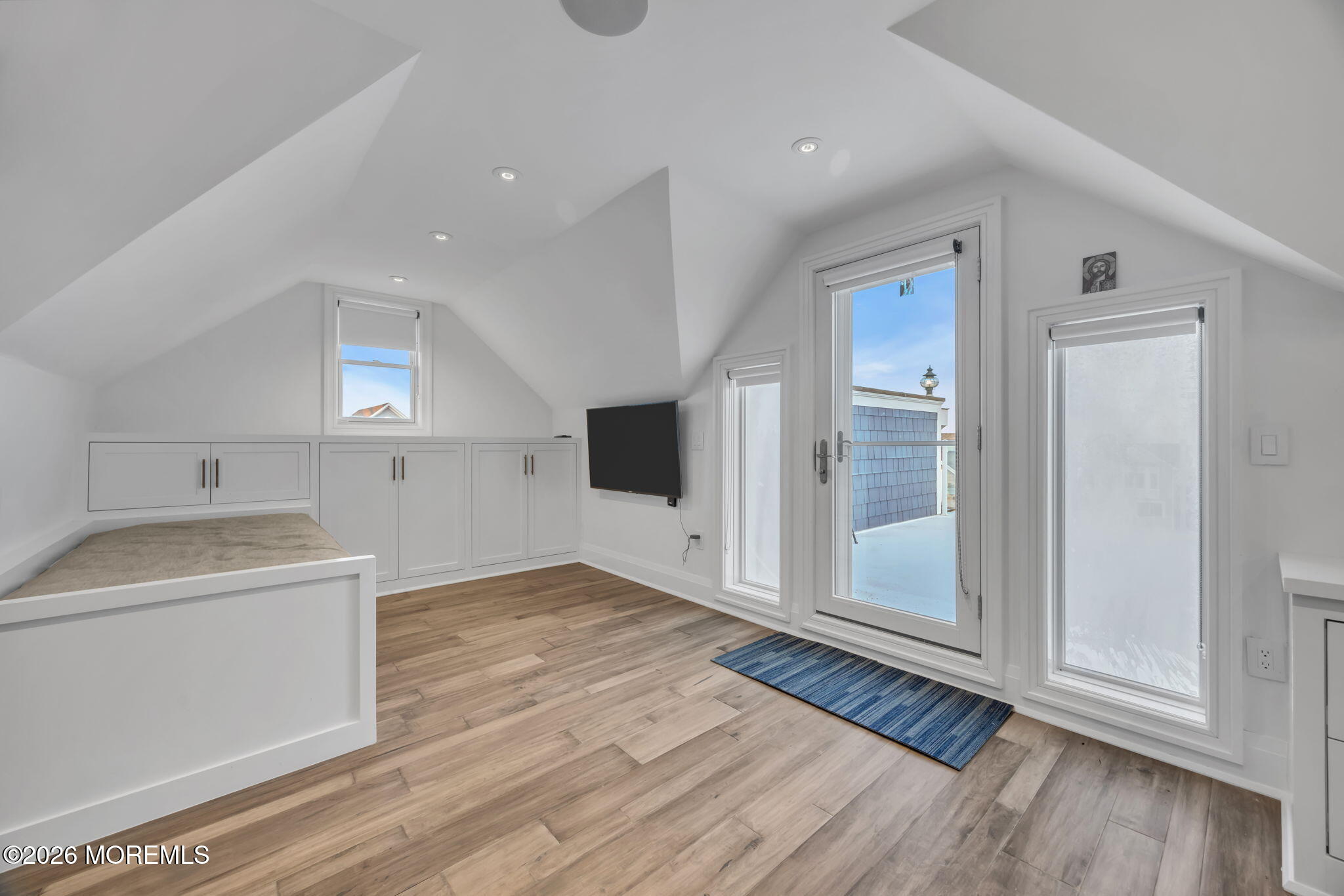 42 Marine Terrace Long Branch, NJ 07740 - Photo 29 of 36 a view of an empty room with wooden floor and a window