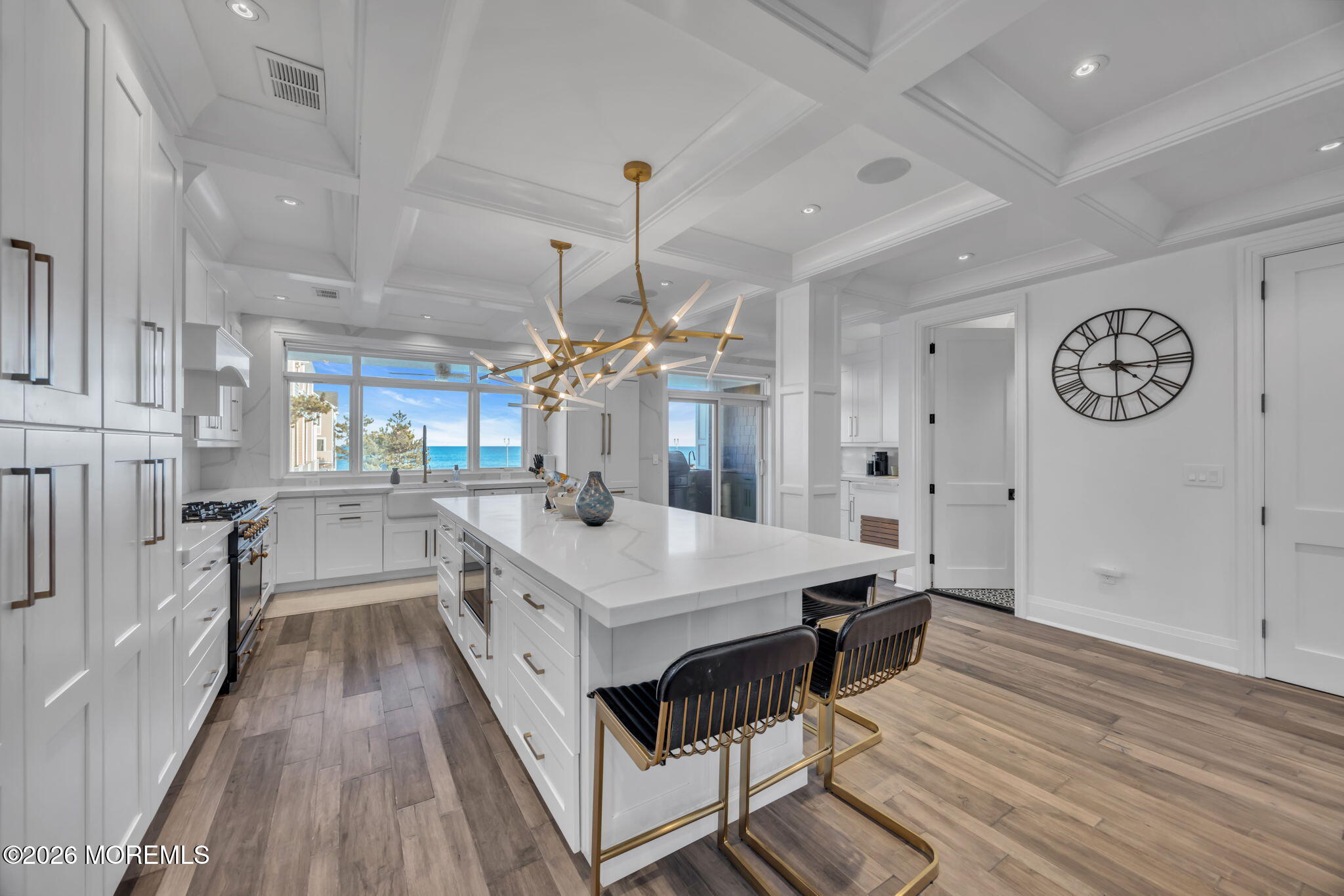 42 Marine Terrace Long Branch, NJ 07740 - Photo 4 of 36 a large white kitchen with a large window a counter space a sink and stainless steel appliances