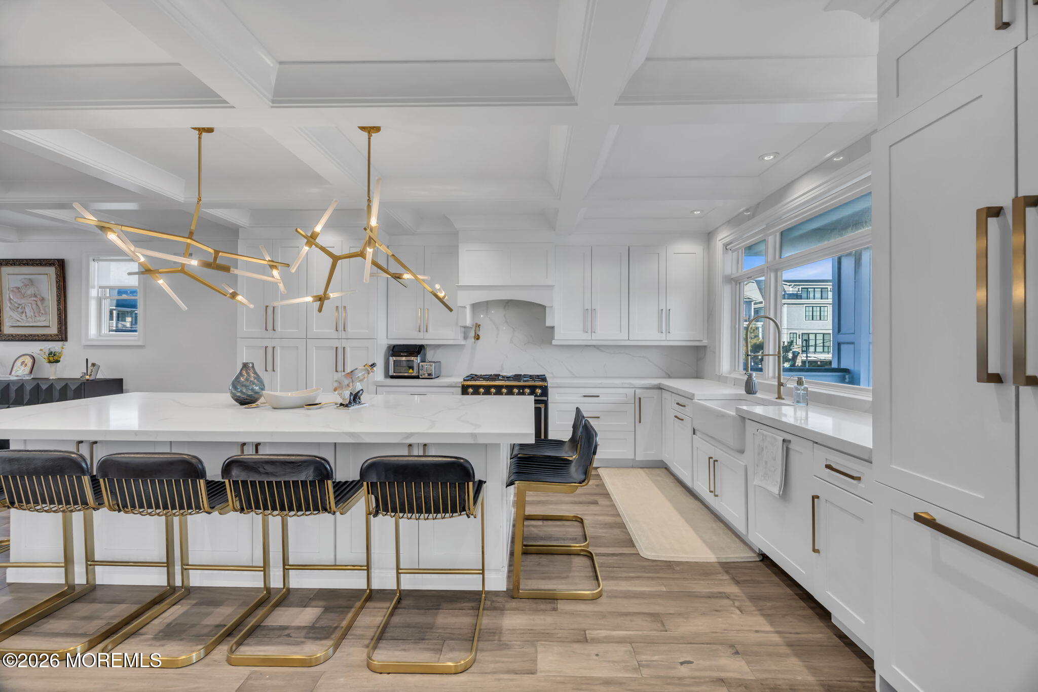 42 Marine Terrace Long Branch, NJ 07740 - Photo 7 of 36 a kitchen with stainless steel appliances kitchen island a table and chairs in it