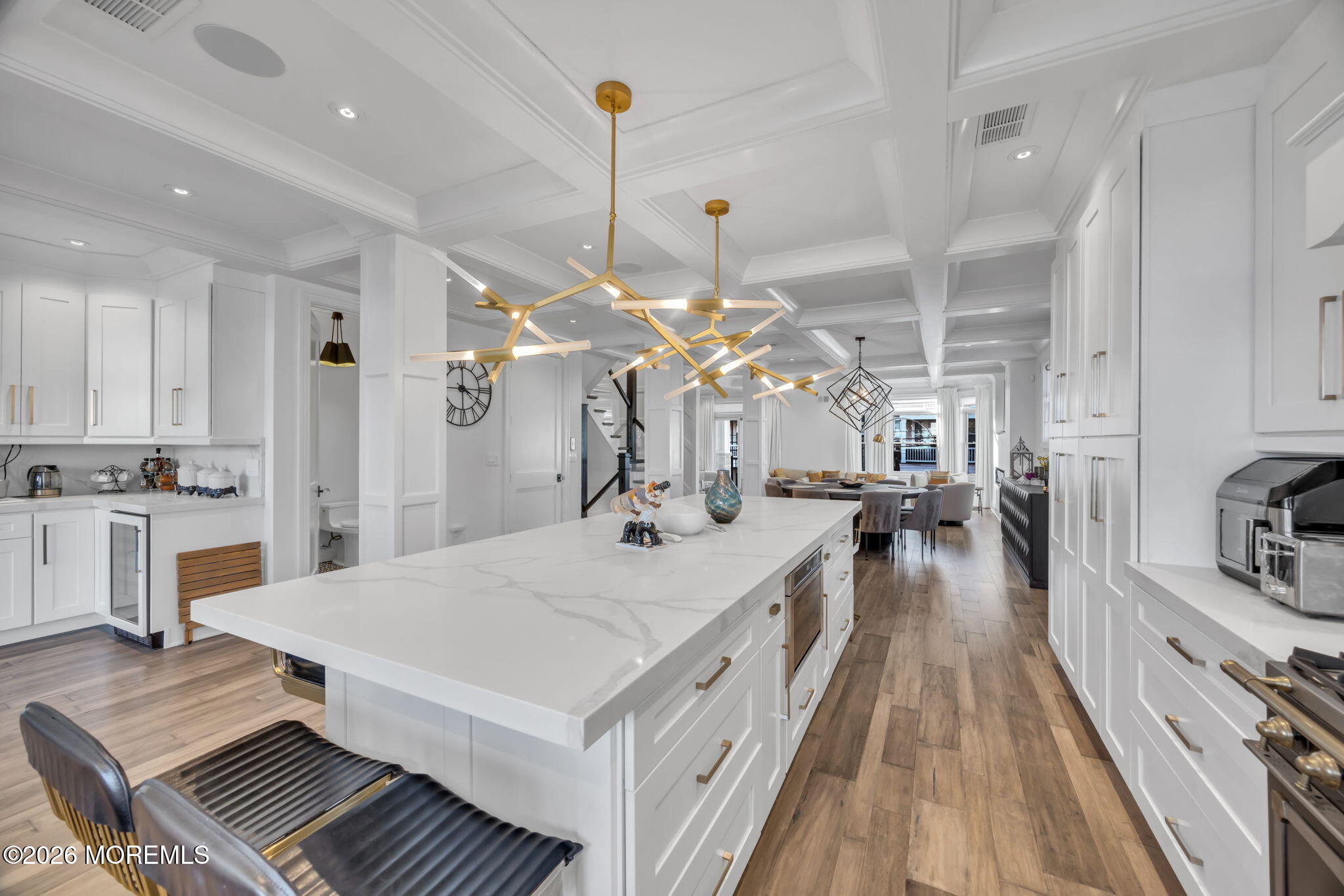 42 Marine Terrace Long Branch, NJ 07740 - Photo 9 of 36 a large kitchen with kitchen island a stove a sink a refrigerator and a chandelier