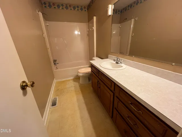 a bathroom with a sink a large mirror and a shower