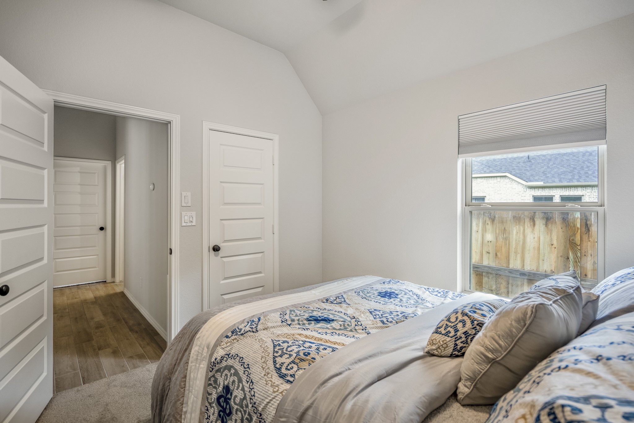 334 Topper Pines Drive Montgomery, TX 77316 - Photo 27 of 49 Looking back across the same bedroom, the closet door comes into view along with a peek into the hallway, where the next bedroom sits at the end and the secondary bath is tucked between the two.