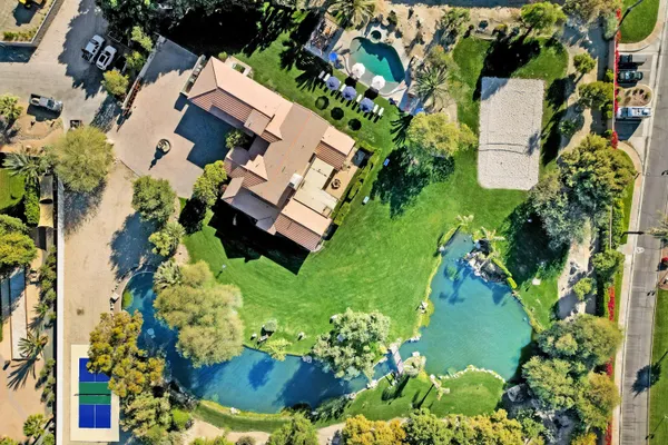 a view of a swimming pool with chairs