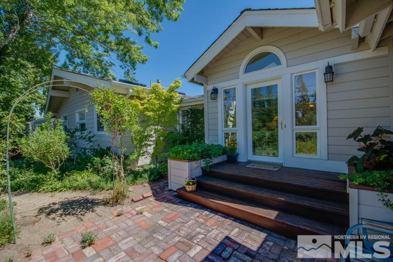 1450 Belford Road Reno, NV 89509 - Photo 1 of 1 a backyard of a house with plants and outdoor seating