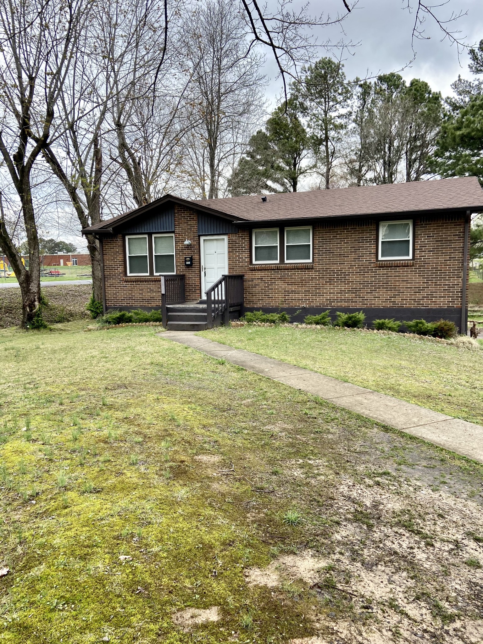 211 Pitt Lane Springfield, TN 37172 - Photo 1 of 18 a front view of a house with yard