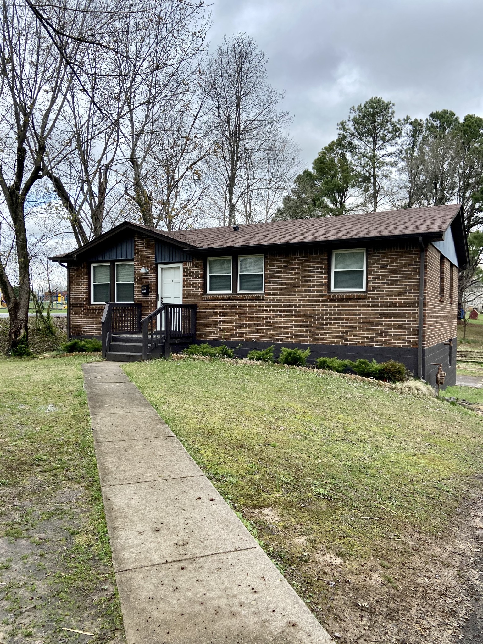 211 Pitt Lane Springfield, TN 37172 - Photo 2 of 18 a front view of a house with a garden