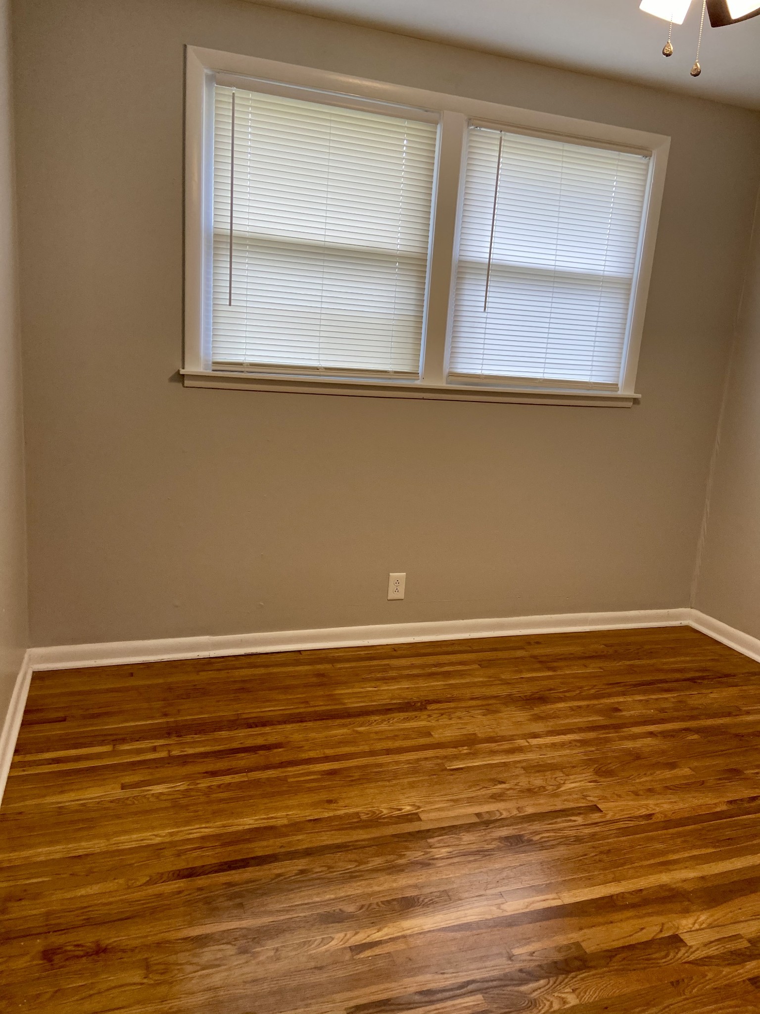 211 Pitt Lane Springfield, TN 37172 - Photo 12 of 18 a view of a room with wooden floor and a window