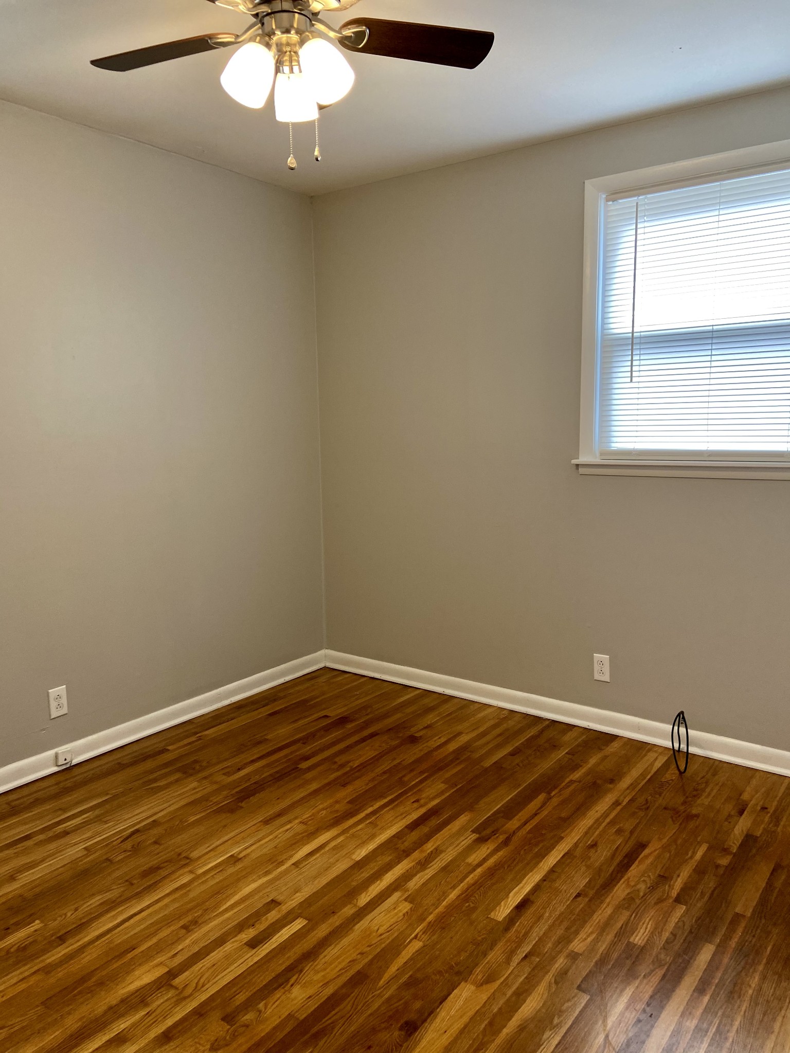 211 Pitt Lane Springfield, TN 37172 - Photo 14 of 18 a view of a room with wooden floor and white walls