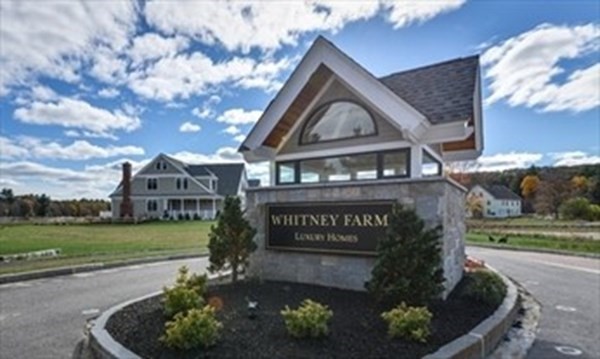 3 Mill Stone Drive, Unit 3 Sherborn, MA 01770 - Photo 1 of 23 a front view of a house with garden