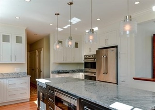 3 Mill Stone Drive, Unit 3 Sherborn, MA 01770 - Photo 11 of 23 a kitchen with a refrigerator a sink and a stove top oven