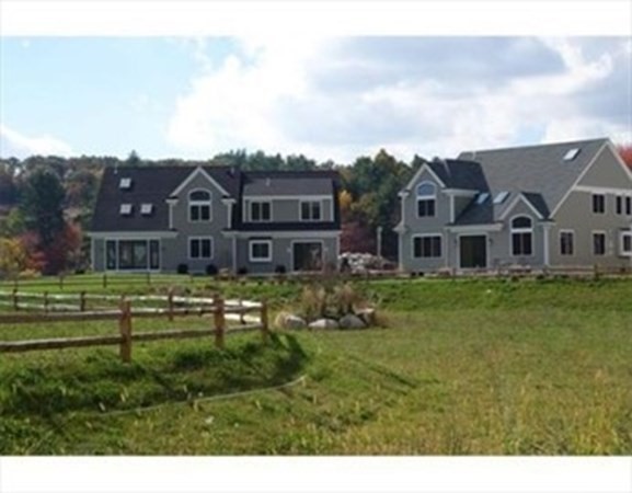 3 Mill Stone Drive, Unit 3 Sherborn, MA 01770 - Photo 23 of 23 a front view of a house with a garden