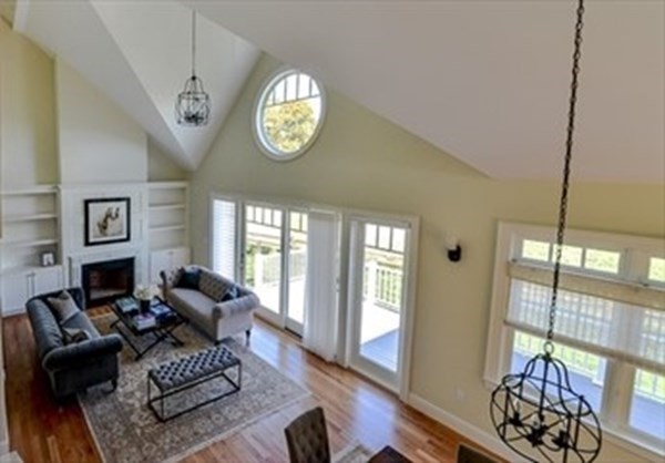 3 Mill Stone Drive, Unit 3 Sherborn, MA 01770 - Photo 6 of 23 a living room with furniture and a large window