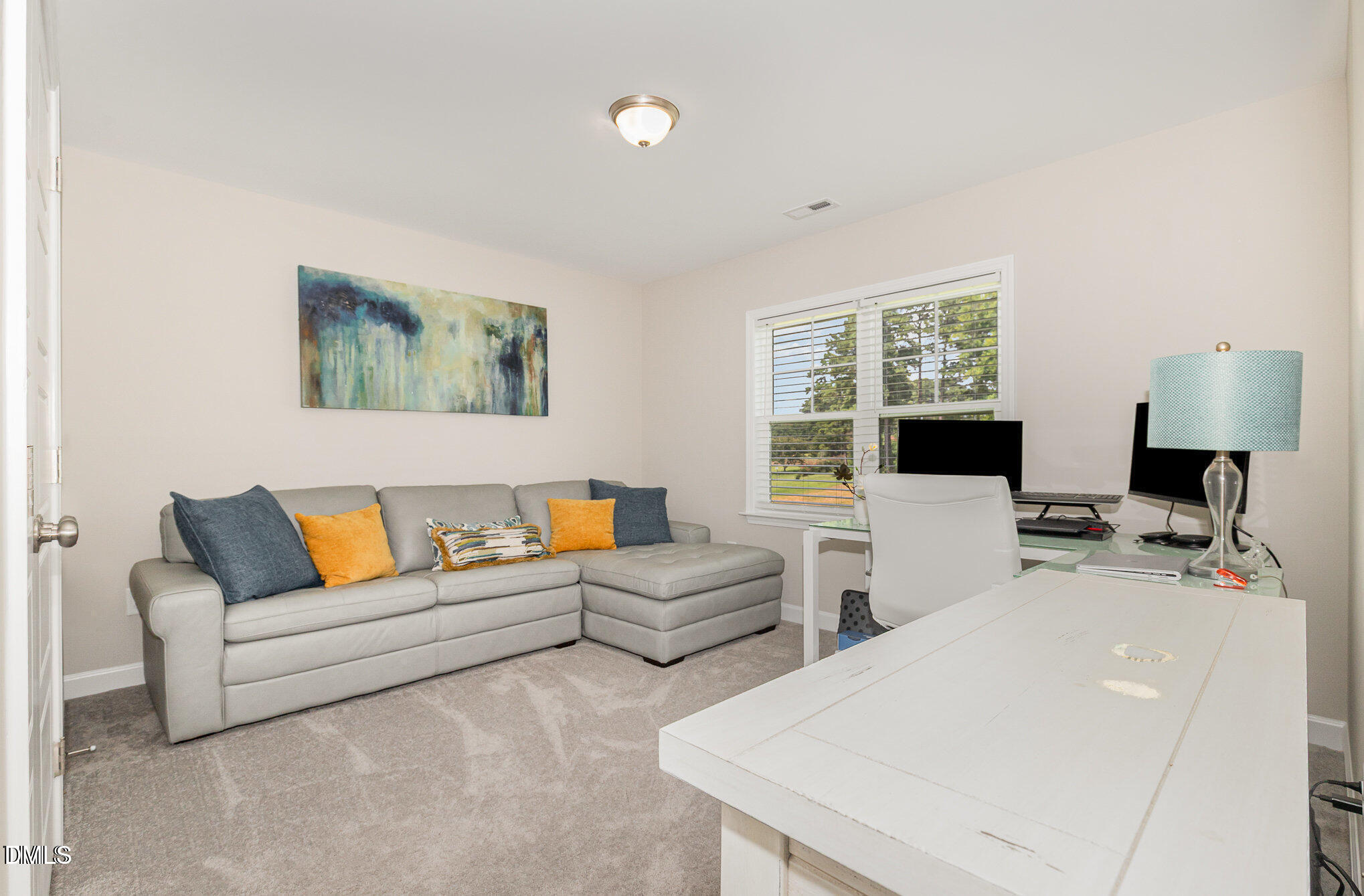 8662 Buckhorn Plantation Road Sims, NC 27880 - Photo 20 of 37 a living room with furniture and a flat screen tv