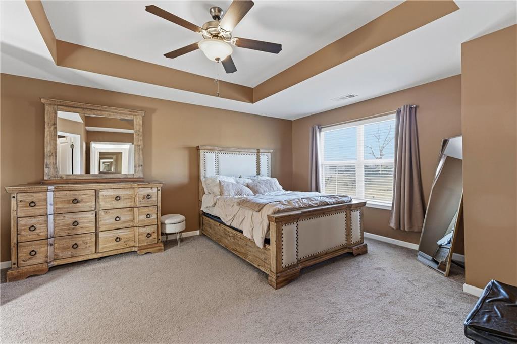 2275 Rolling Trail Lithonia, GA 30058 - Photo 15 of 38 a bed room with a bed and a ceiling fan