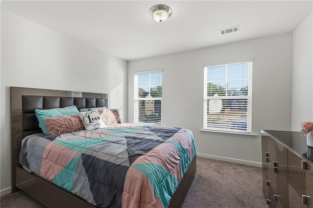 2275 Rolling Trail Lithonia, GA 30058 - Photo 23 of 38 a bedroom with a bed and a window