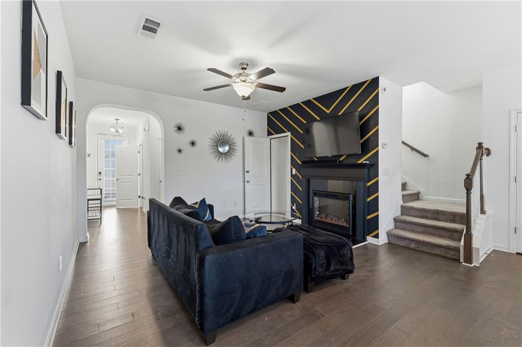 2275 Rolling Trail Lithonia, GA 30058 - Photo 4 of 38 a living room with furniture and wooden floor