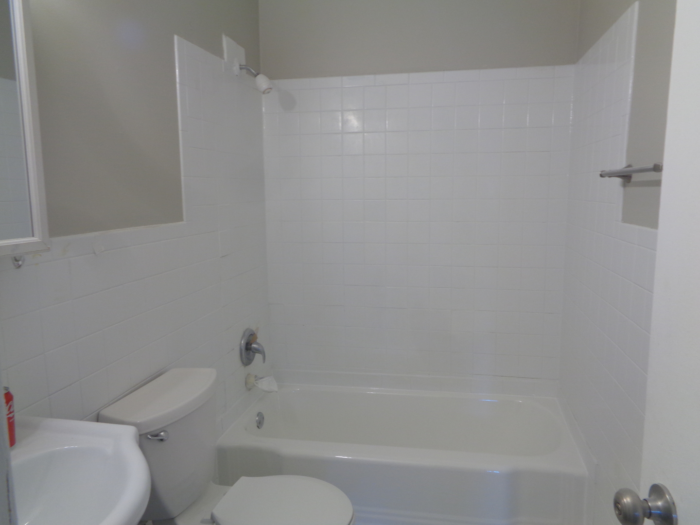 1340 North Main Street, Unit A13 Wheaton, IL 60187 - Photo 6 of 6 a bathroom with a toilet and a bathtub