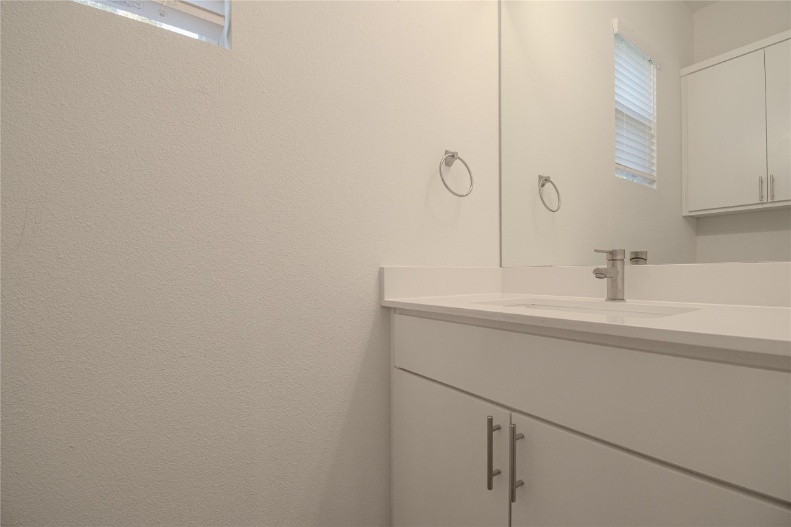 6325 Ponca Street, Unit A Austin, TX 78741 - Photo 14 of 21 a bathroom with a sink and vanity