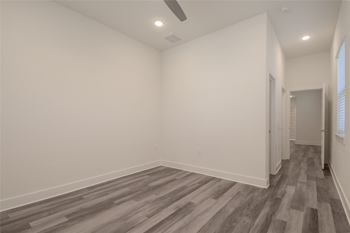 6325 Ponca Street, Unit A Austin, TX 78741 - Photo 16 of 21 a view of a room with wooden floor and a hallway