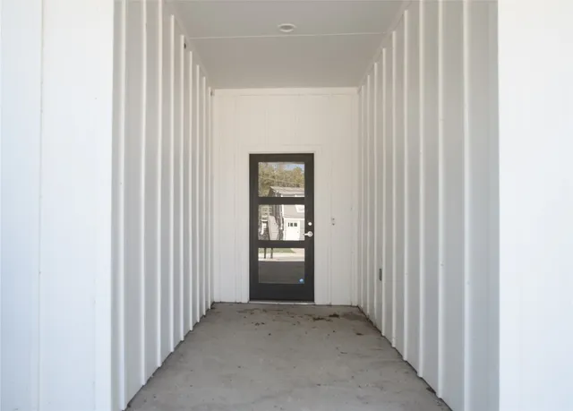 a view of a hallway with windows