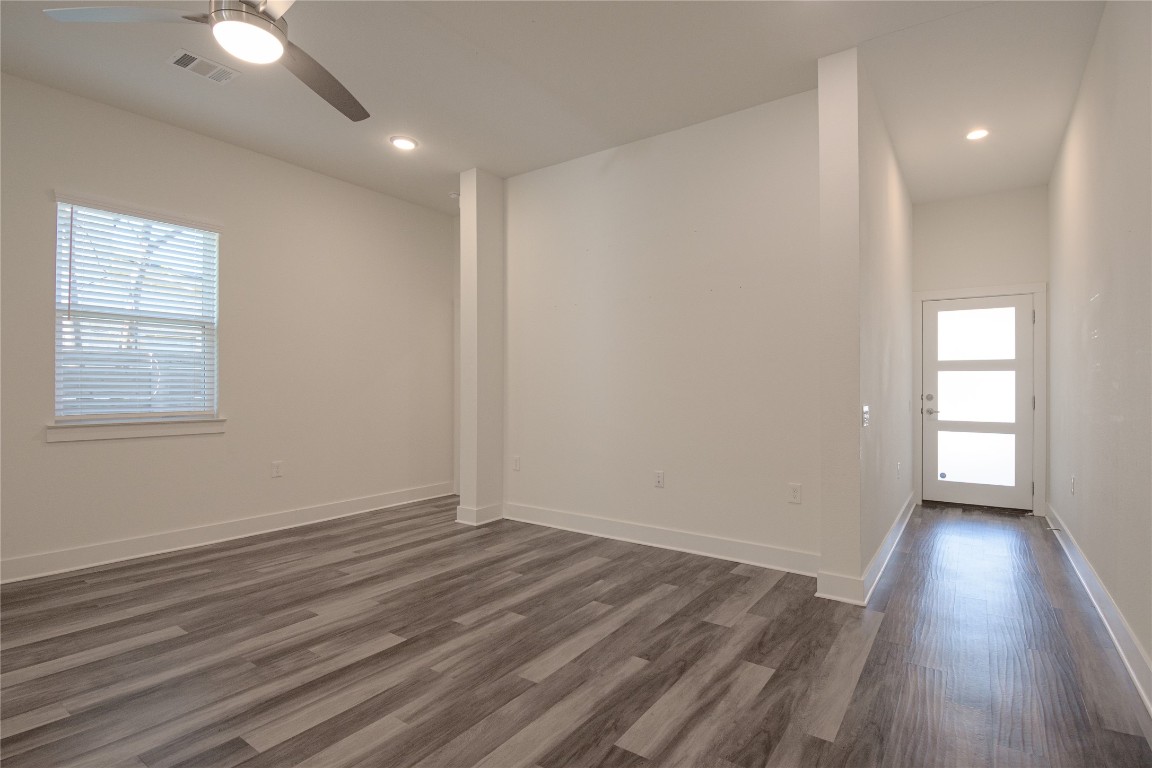 6325 Ponca Street, Unit A Austin, TX 78741 - Photo 5 of 21 wooden floor in an empty room with a window