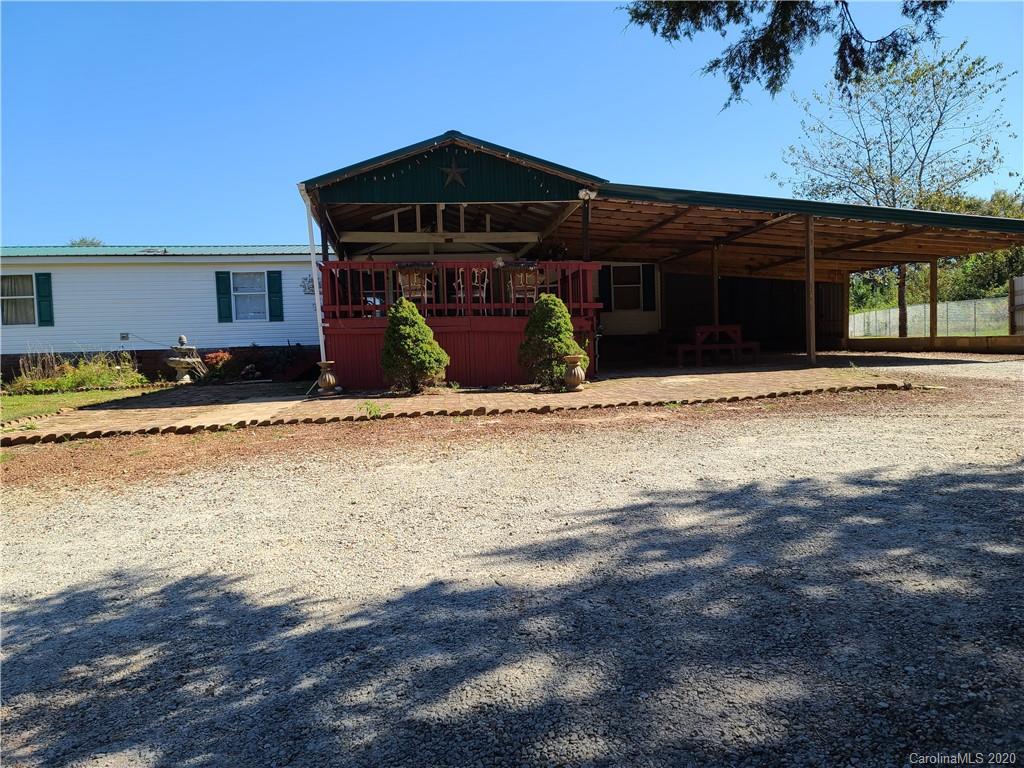 7080 Woodleaf Road Woodleaf, NC 27054 - Photo 1 of 21 a front view of a house with a yard
