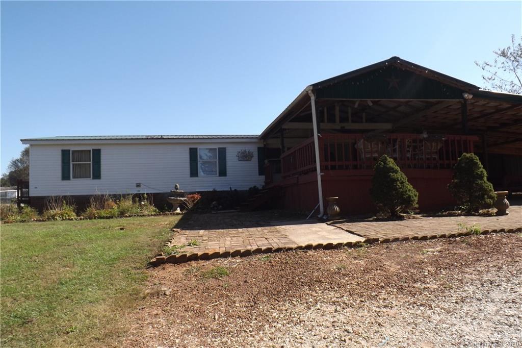 7080 Woodleaf Road Woodleaf, NC 27054 - Photo 4 of 21 a front view of a house with a yard