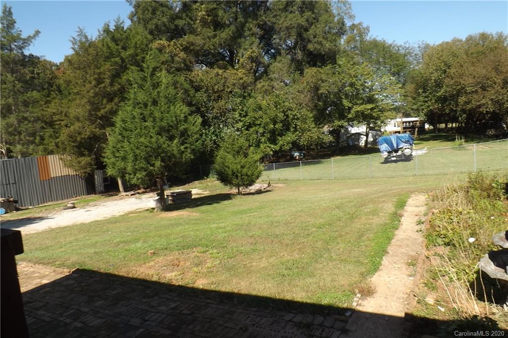 7080 Woodleaf Road Woodleaf, NC 27054 - Photo 5 of 21 a view of a yard with swimming pool