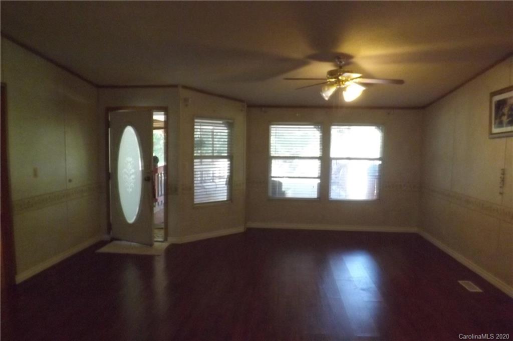 7080 Woodleaf Road Woodleaf, NC 27054 - Photo 6 of 21 a view of a room with wooden floor and a window