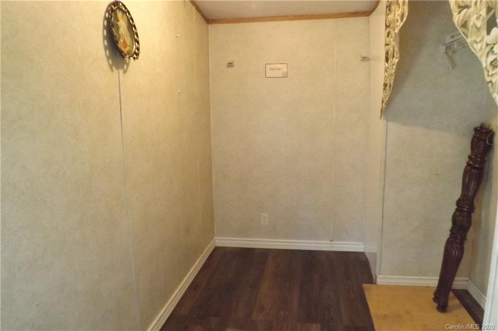 7080 Woodleaf Road Woodleaf, NC 27054 - Photo 10 of 21 a small space with wooden floor and a window