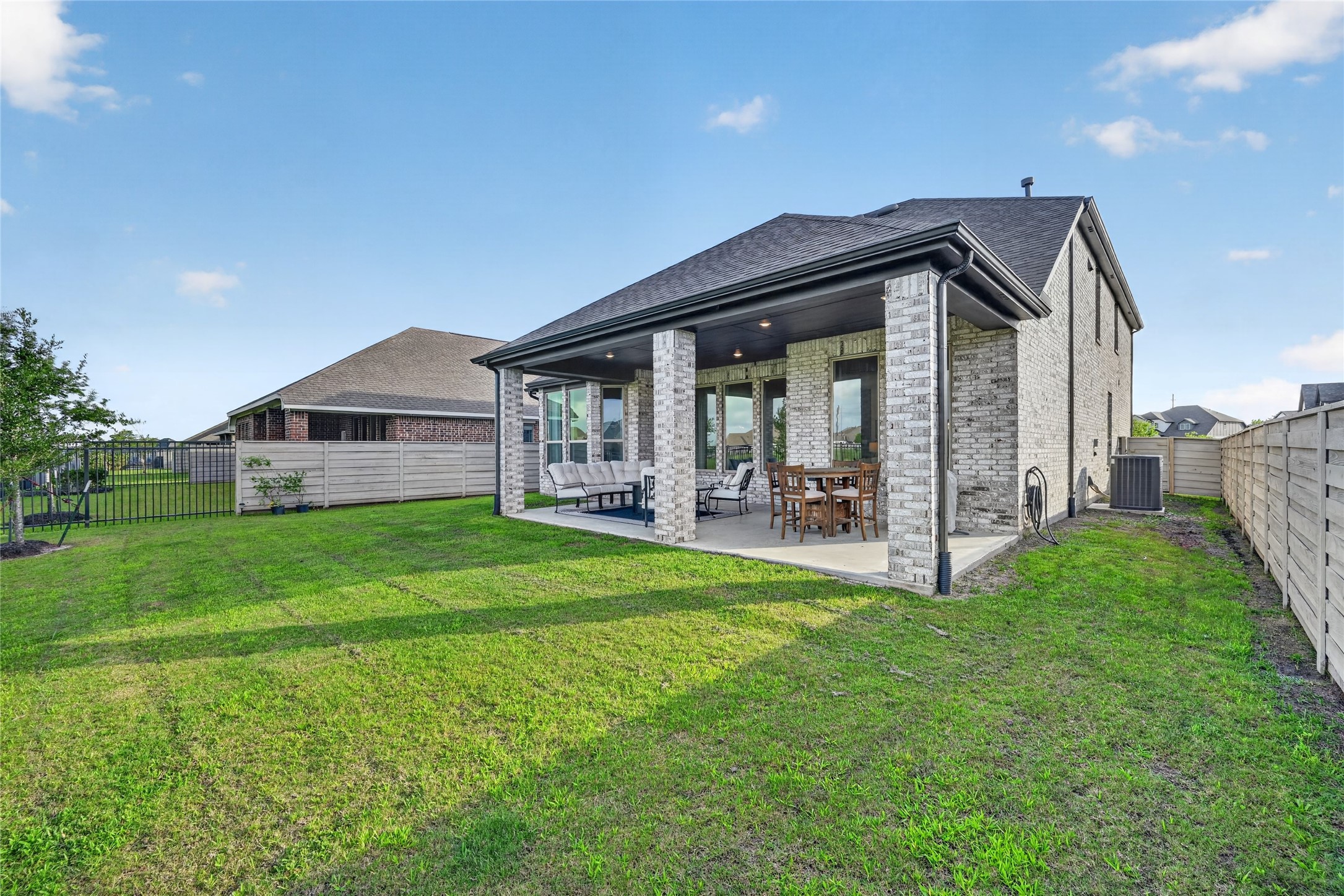 4439 Stone Ridge Lane Manvel, TX 77578 - Photo 45 of 48 a view of a house with backyard and porch