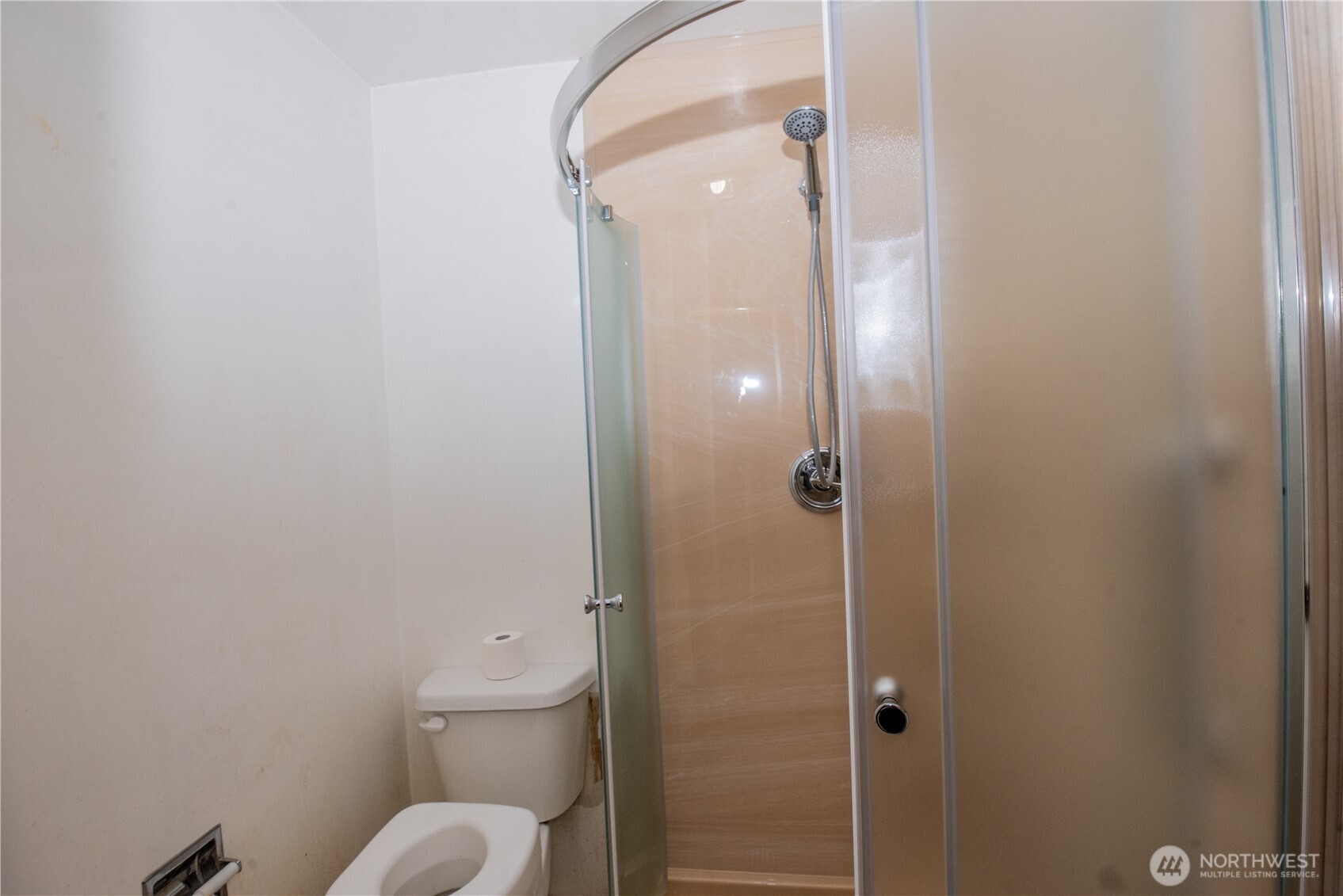 10015 Southeast 192nd Street Renton, WA 98055 - Photo 17 of 39 a bathroom with a granite countertop toilet and a shower