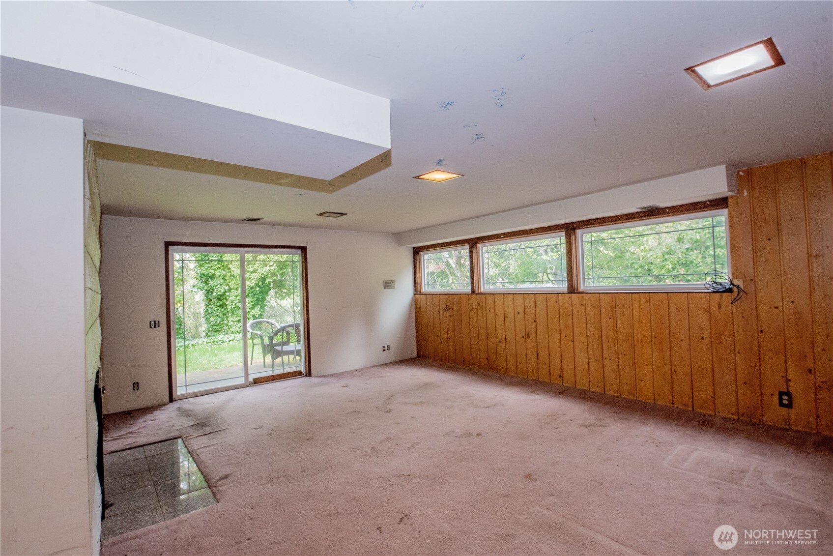 10015 Southeast 192nd Street Renton, WA 98055 - Photo 20 of 39 an empty room with large windows and outdoor view
