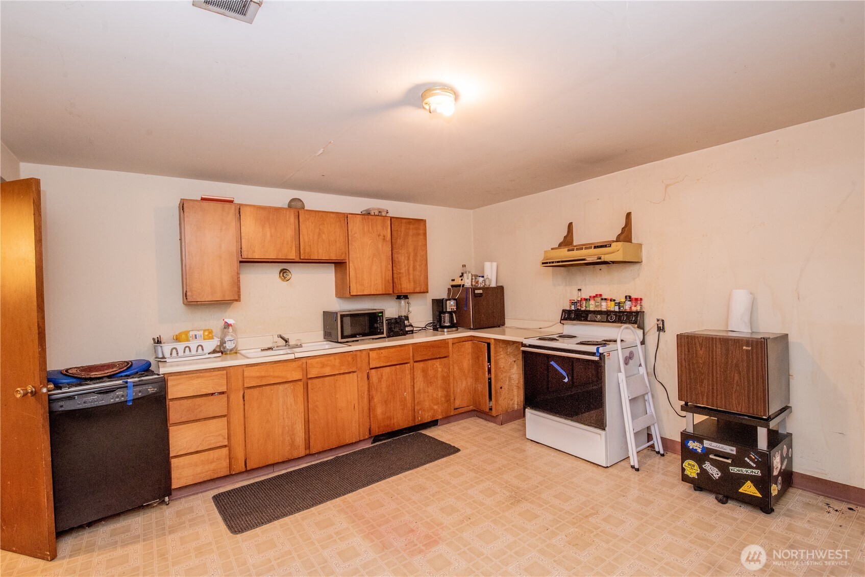 10015 Southeast 192nd Street Renton, WA 98055 - Photo 27 of 39 a kitchen with stainless steel appliances granite countertop a workspace and a sink