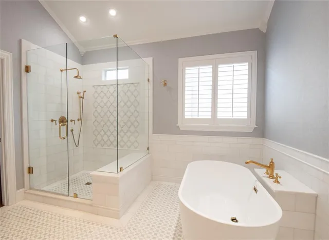 a bathroom with a bathtub and a shower