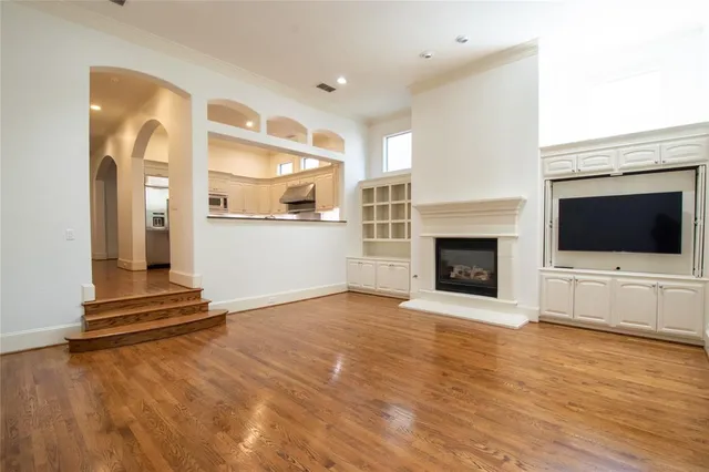 a view of a livingroom with an empty space and a fireplace