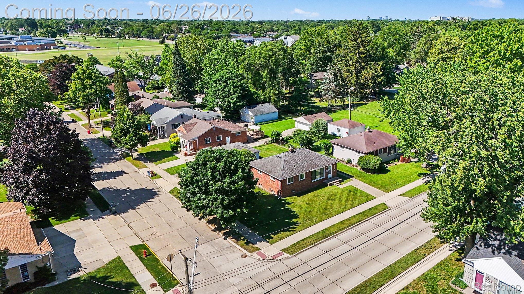 1209 Massoit Road Clawson, MI 48017 - Photo 4 of 25 Residential neighborhood featuring mature trees, manicured lawns, and paved streets